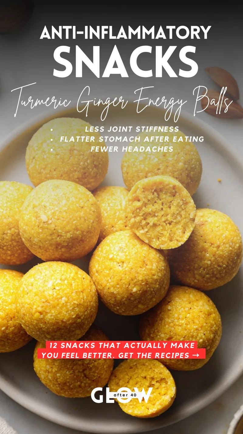 A light-colored bowl filled with bright yellow, round turmeric ginger energy balls. One ball is broken in half, revealing a textured, dense center made with almonds and dates. Text overlays mention benefits like less joint stiffness, a flatter stomach after eating, and fewer headaches.