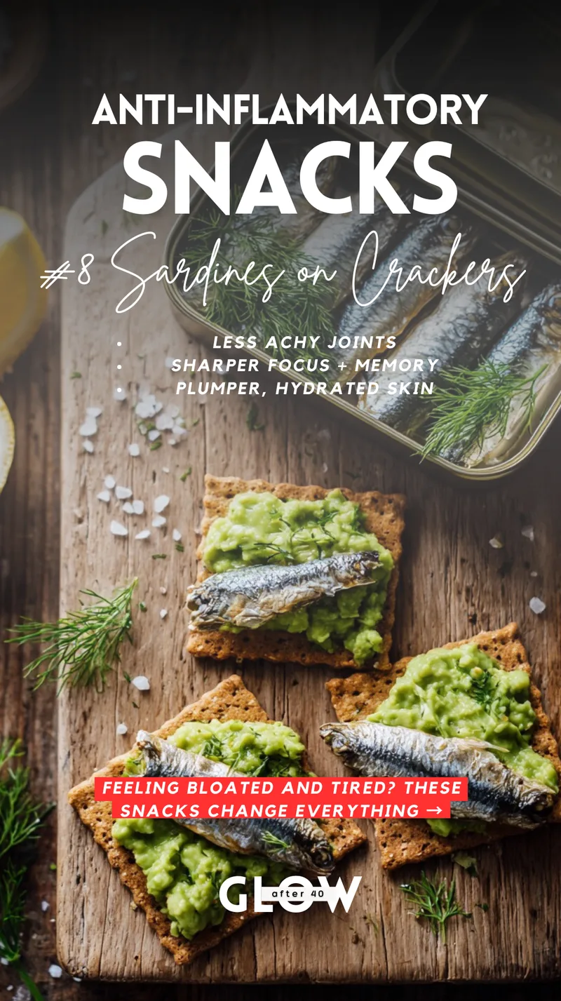 Three square whole grain crackers topped with mashed green avocado, whole silver sardines, and sprigs of fresh dill, arranged on a rustic wooden cutting board. Text overlays mention benefits like less achy joints, sharper focus, and plumper, hydrated skin.